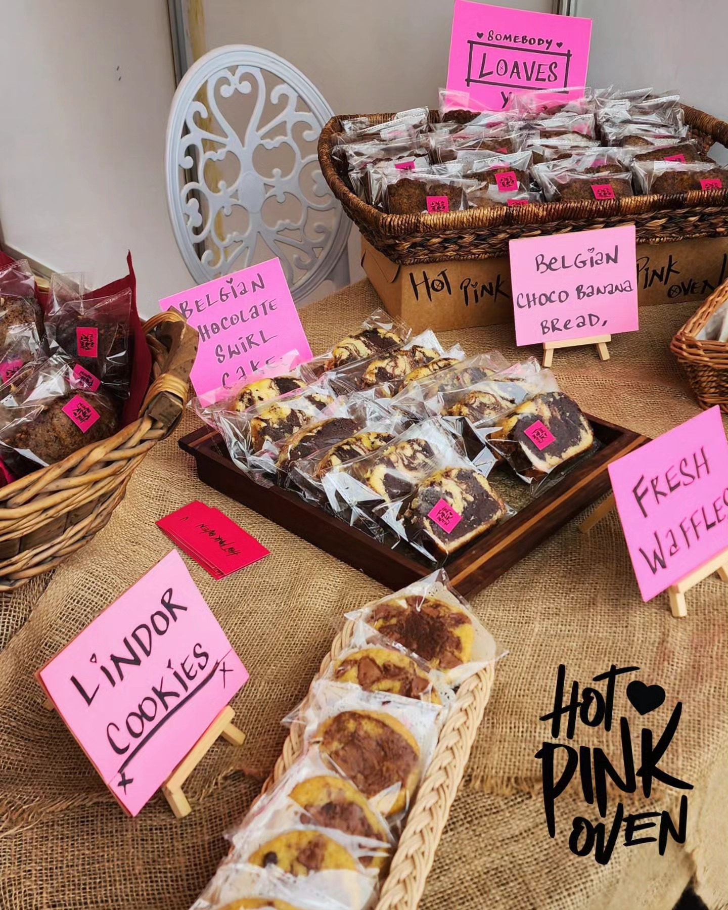 Hot Pink Oven pop-up stall with the round pink sign